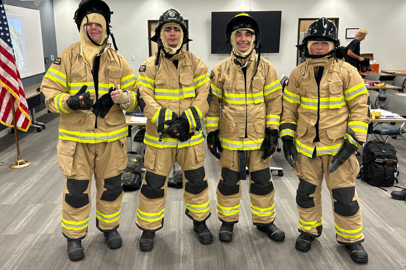 Group of firefighter Explorer trainees posing together during training.